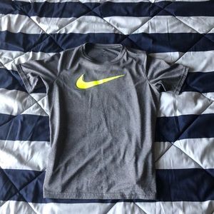 A youth XL Nike t-shirt with neon yellow symbol.